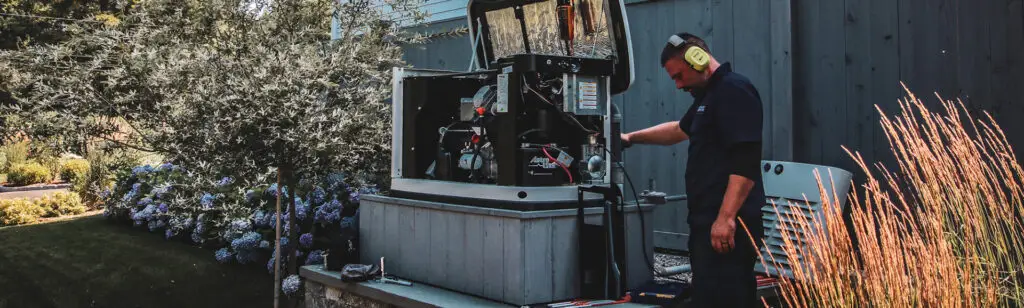 Technician providing generator maintenance