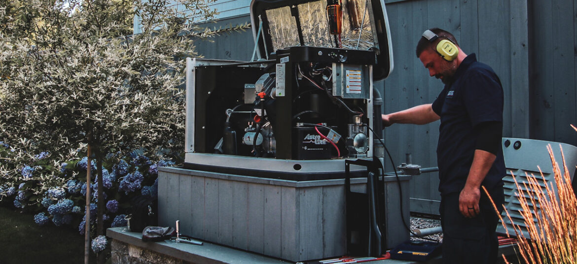 Technician providing generator maintenance
