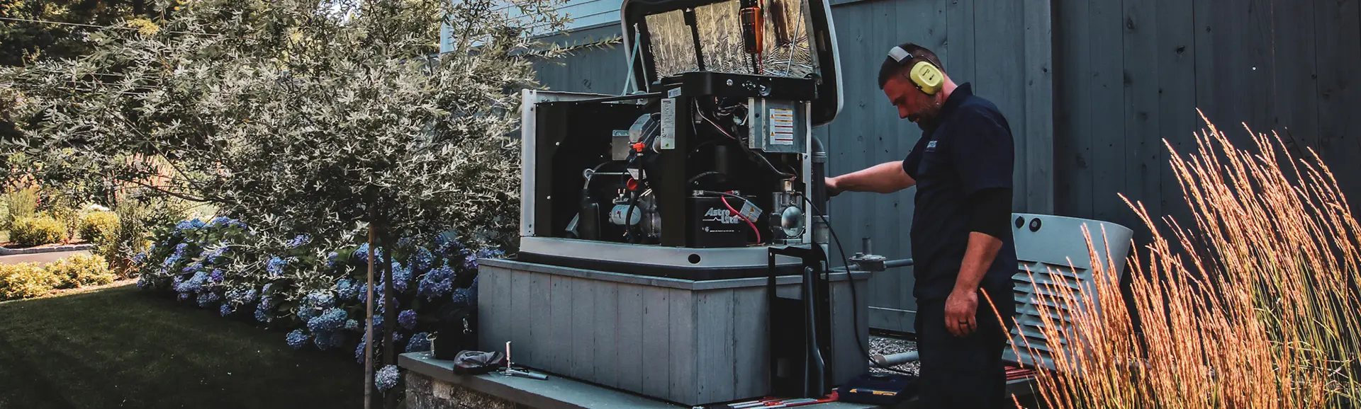 Technician providing generator maintenance