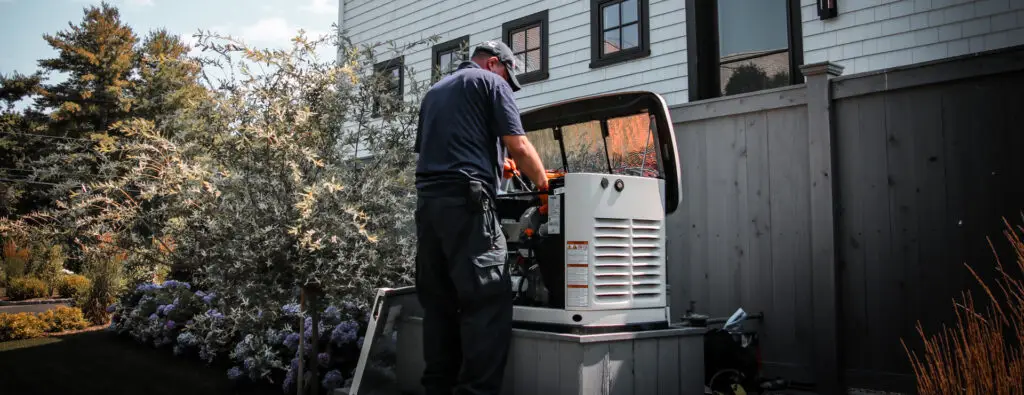 Technician providing generator maintenance