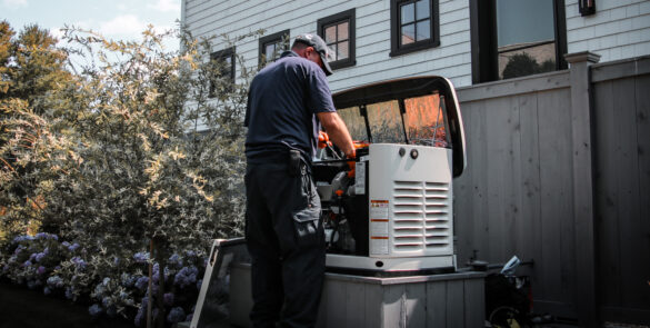 Technician providing generator maintenance