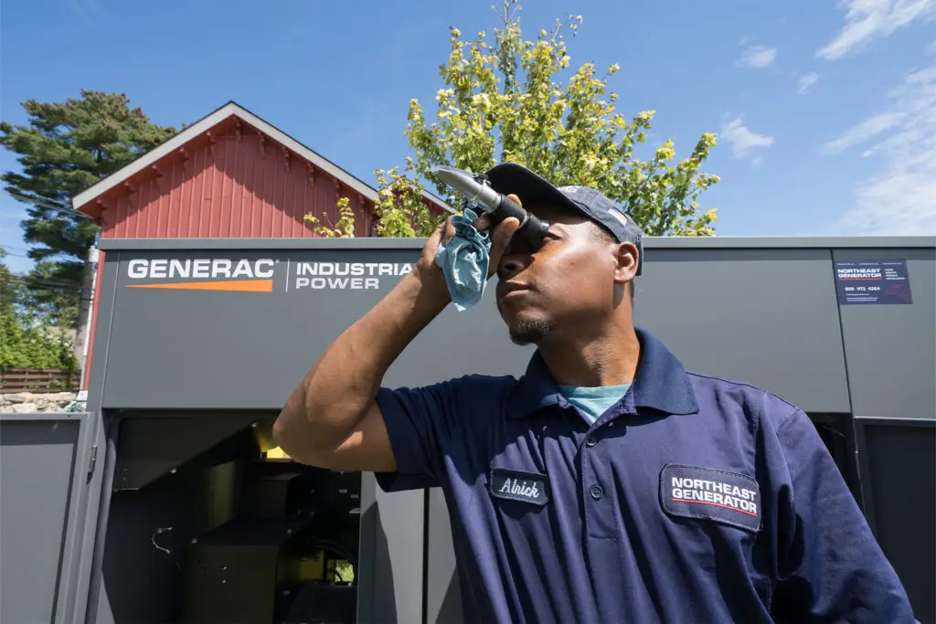 Northeast Generator technician inspecting a Generac Industrial Power generator