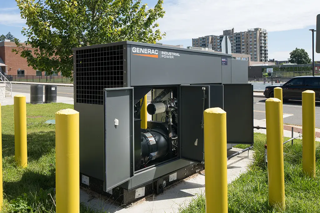Generac Industrial Power commercial generator protected by yellow bollards